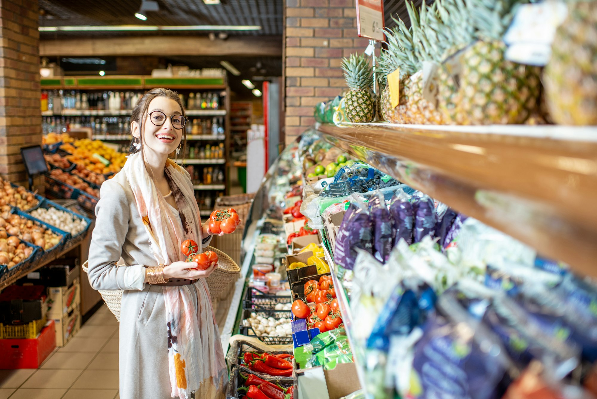 Woman choosing vegetables in the supermarket